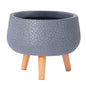Portamaceta Con Textura Fibra De Arcilla  Gris Y Patas De Madera Natural